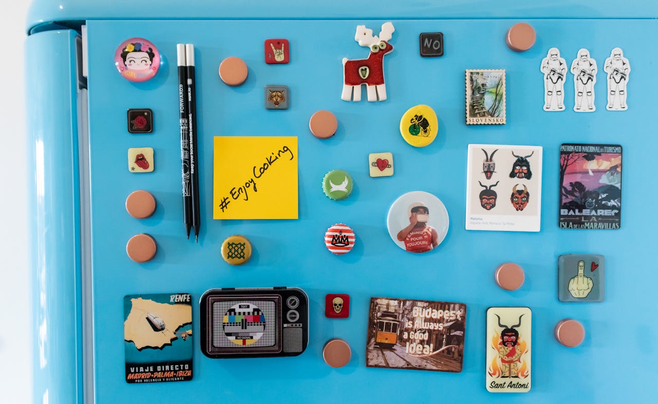 Close-up of a Blue Refrigerator with Colorful Magnets